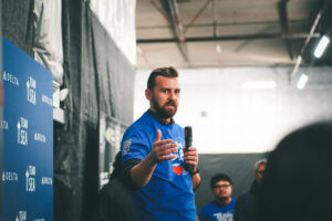 Man speaking at a private pickleball event at Side Out Tsunami Seattle