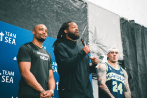Michael Bennett speaking at a private pickleball event at Side Out Tsunami Seattle