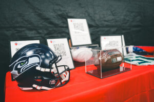 Signed football and seahawks helmet at a private pickleball event at side out tsunami seattle