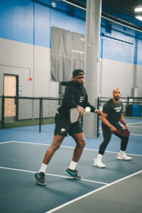 Cliff Avril and Doug Baldwin playing pickleball at Side Out Tsunami Seattle.