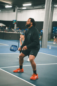 player playing pickleball at a private pickleball event at side out tsunami seattle