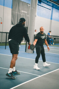 Doug Baldwin playing pickleball at Side Out Tsunami Seattle.